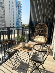 a balcony with a table and chairs on a balcony at Yas Island canal 2- where luxury meets comfort next to Formula 1 in Abu Dhabi