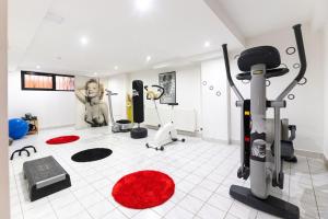 a room with a gym with exercise equipment in it at Villa Markus in Slavonski Brod