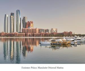 a view of a city with boats in the water at Emirates Palace Mandarin Oriental, Abu Dhabi in Abu Dhabi