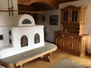 a kitchen with a wood stove in a room at Haus Gerlinde Schernthaner in Langkampfen