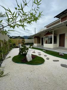 a garden with rocks in the middle of a house at Muzi Boutique Hotel in Ipoh