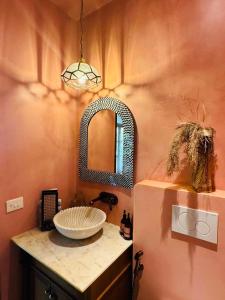 a bathroom with a sink and a mirror at Casa Azul- Luxury 4bhk Assagao with private pool in Vagator