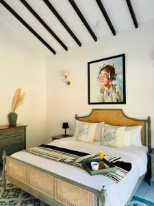 a bedroom with a bed with a tray of food on it at Casa Azul- Luxury 4bhk Assagao with private pool in Vagator +12 photos