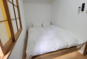 Postel nebo postele na pokoji v ubytování Hostel Belle Via Tokyo