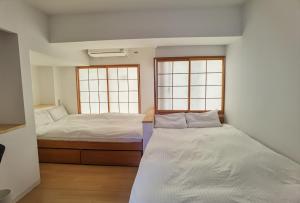 Postel nebo postele na pokoji v ubytování Hostel Belle Via Tokyo