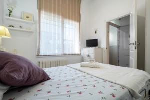 Posteľ alebo postele v izbe v ubytovaní Hauzify I Casa d'Anselm Clavé