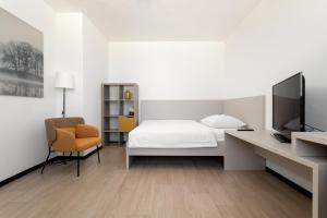 Posteľ alebo postele v izbe v ubytovaní Hotel Koruna