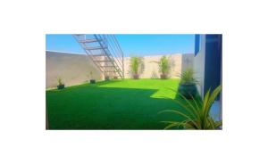 a rendering of a green yard with plants at Reef Hotel in Shamshabad