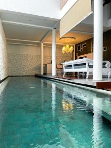 a swimming pool in a house at Calm Villa in Seminyak