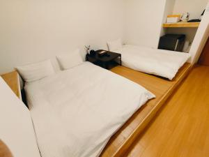 Postel nebo postele na pokoji v ubytování Hostel Belle Via Tokyo