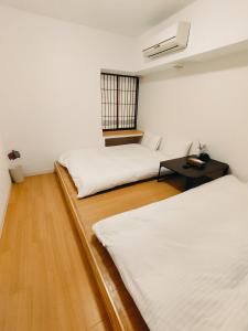 Postel nebo postele na pokoji v ubytování Hostel Belle Via Tokyo