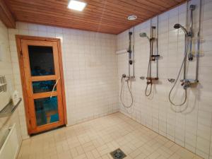 a bathroom with a shower and a glass door at Kolin Runo in Yläkoli