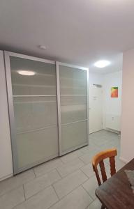 a room with sliding glass doors and a table at Apartment/Wohnung direkt in Aschaffenburg in Aschaffenburg