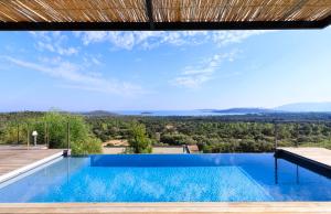 a swimming pool with a view from a house at Villa Nepita in Lecci +12 photos