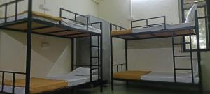 Postel nebo postele na pokoji v ubytování Kritika Accoommdates P G