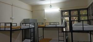 Postel nebo postele na pokoji v ubytování Kritika Accoommdates P G
