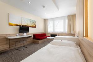 Posteľ alebo postele v izbe v ubytovaní Hotel Koruna