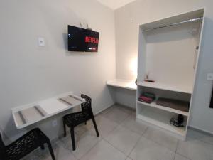 TV a/nebo společenská místnost v ubytování Xavi Studio - Proximo ao Boulevard Shopping, Av Nacoes Unidas e Nuno de Assis.