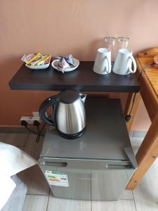 Príslušenstvo na prípravu kávy alebo čaju v ubytovaní Aero Lodge Guest House