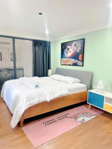 Säng eller sängar i ett rum på Gachilly House - Your Cozy Home In The Heart Of The BMT City
