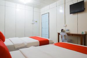 Postel nebo postele na pokoji v ubytování OYO 90037 The 7 Lodge Tambunan