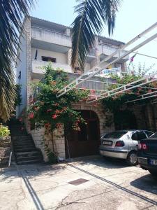 a house with a car parked in front of it at Apartment Antea in Tučepi