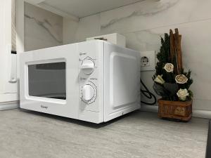 a microwave oven sitting on top of a room at Apartamentos para 10 personas en Barrio del Pilar in Madrid
