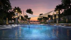 a large swimming pool with palm trees and a sunset at Best Place In Jomtien, Breath Taking Views in Jomtien Beach