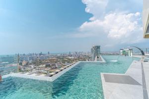 a swimming pool on the roof of a building at Best Place In Jomtien, Breath Taking Views in Jomtien Beach