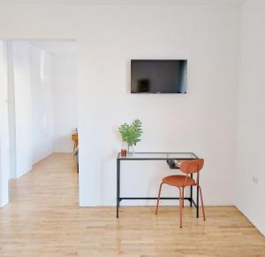 TV a/nebo společenská místnost v ubytování GuestHouse Maison Comfort