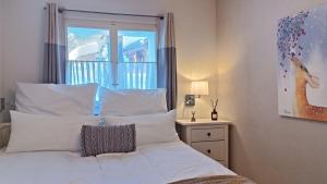 Voodi või voodid majutusasutuse Chalet M toas