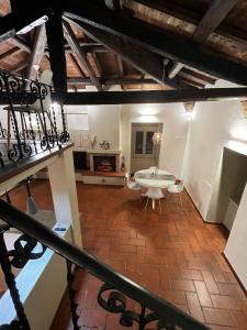 an attic room with a table and a fireplace at CHARME in Civita Castellana
