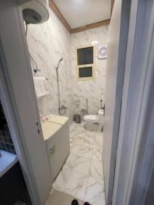 a bathroom with a sink and a toilet at Arkan Dareen in Buraydah +49 photos