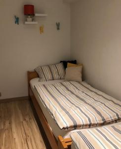Säng eller sängar i ett rum på appartement DE WATERLIJN
