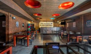 a dining room with tables and chairs in a restaurant at Treebo Trend Seagate in Ernakulam