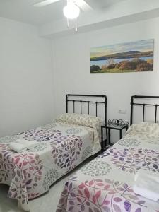 Giường trong phòng chung tại Casa Rural Aguilar