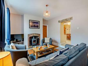 a living room with a couch and a fireplace at 3 Bed in Bamford PK838 in Bamford