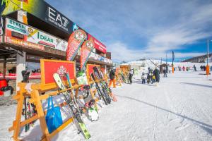 a ski shop with skis on display in the snow at La Tana Dell'Ermellino 3 Ski In Ski Out - Happy Rentals in Sestriere