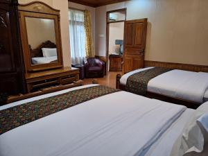 מיטה או מיטות בחדר ב-Mifan Resort And Water Park