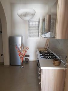 Nhà bếp/bếp nhỏ tại CALALUNA COUNTRY HOUSE - PUNTA PROSCIUTTO