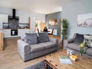 a living room with two couches and a table at 1 bed property in Durham CN208 in Lanchester