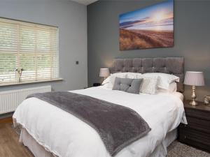a bedroom with a large white bed and a window at 1 bed property in Durham CN208 in Lanchester