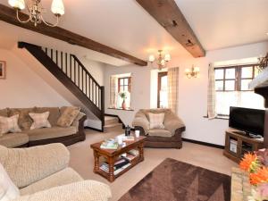 a living room with couches and a tv at 2 bed property in Shanklin Isle of Wight IC059 in Shanklin