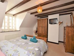 a bedroom with a bed and a tv on a wall at 2 bed property in Shanklin Isle of Wight IC059 in Shanklin