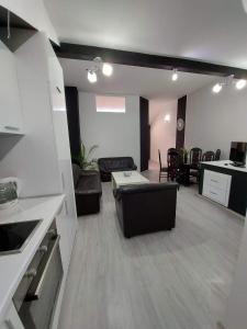 a living room with a couch and a table at Merter Apartments in Kavadarci