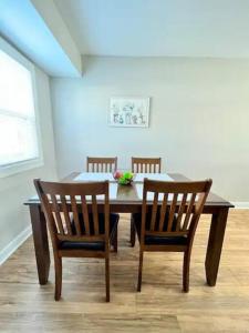 a dining room with a table and two chairs at Modern 2-story apt w/ high speed Wi-Fi & Patio! in Charlotte