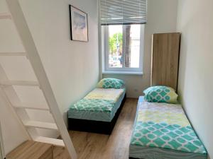 Łóżko lub łóżka w pokoju w obiekcie Raisa Apartments Lerchenfelder Gürtel 30