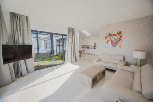 TV a/nebo společenská místnost v ubytování Atlántico Plaza Apartments