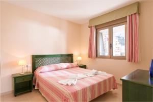 Ένα ή περισσότερα κρεβάτια σε δωμάτιο στο Apartamento Larimar - PlusHolidays +12 φωτογραφίες