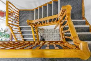 a wooden spiral staircase in a house at The Rooftops in Boston